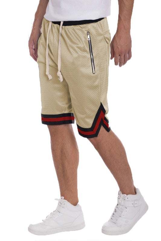 Basketball shorts with striped band, mesh fabric, side zippered pockets, and elastic waistband.